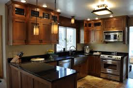 Combine white uppers + black lowers. 75 Beautiful Kitchen With Brown Cabinets And Black Countertops Pictures Ideas July 2021 Houzz