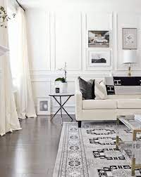 Chic living room boasts a wainscot trim illuminated by tt double sconces over a sleek black fireplace accented with a herringbone firebox. Who Doesn T Love A Good Accent The 10 Best Accent Wall Ideas Crafted By The Hunts