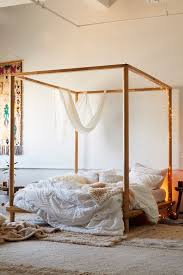 A grand canopy bed designed by architect michele bonan emphasizes the high ceilings of a bedroom in an apartment in a historic palazzo in florence. Eva Wooden Canopy Bed Urban Outfitters