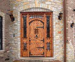 The Metal Work On This Knotty Alder Door Makes An Entry Way Into A Castle Mansiondoors Exteriordoorswithglas Wood Exterior Door Rustic Doors Exterior Doors