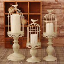 White Bird Cage Candle Holder Bird Cage Candle Holders Make For Adorable Home Decor Items Made Out Of Metal Google Search Metal Candle Stand Metal Candle Lanterns Candle Lanterns