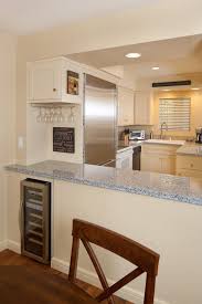 It also acts as a serving area for the dining room — and even a patio — with easy access. Polo Retreat Pass Through Kitchen American Traditional Dining Room Santa Barbara By Trillium Enterprises Inc Houzz