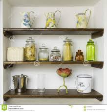 vintage kitchen shelves with jars, jugs