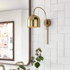 Crafted of plastic acrylic in a clean white finish, this fixture features a rectangular frame backplate with a curved, molded front measuring 10.5 h x 9 w x 4 d. Wade Logan Karlie 1 Light Plug In Armed Sconce Reviews Wayfair