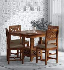 The modern dining tables give a unique touch to the old fashioned dining room. Buy Aura Solid Wood 4 Seater Dining Set In Provincial Teak Finish Woodsworth By Pepperfry Online Transitional 4 Seater Dining Sets Dining Furniture Pepperfry Product