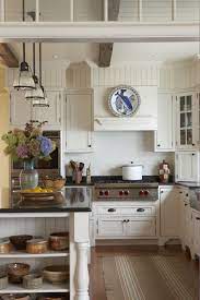 A Timeless Kitchen Gives A Country Feel By Adding Pottery And A Striped Textured Kitchen Soffit Classy Kitchen House And Home Magazine