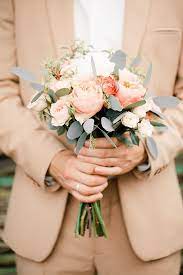 From a groom ' s corsage to epic wedding centerpieces, choosing the wedding flowers that you love is important, and should be done early on in the wedding planning process. Grey And Peach Wedding Bouquet Peach Wedding Bridal Bouquet Wedding Bridal Bouquets Peach Wedding Peach Bouquet