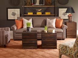A white fireplace and ceiling beams balance dark walnut floors. 10 Shades Of Brown For Your Living Room