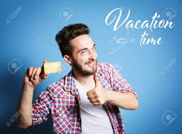 When it comes to redeeming points for travel, experts estimate that the credit card points in many rewards programs are worth between 1 cent and 2 cents each. Vacation Time Concept Young Man Holding Credit Card On Blue Background Stock Photo Picture And Royalty Free Image Image 77458581