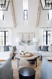 In living rooms, bedrooms or open foyers, where people might be walking underneath a fixture: Proof That Cream White Is Anything But Boring Lark Linen House Interior Large Living Room Transitional Living Rooms