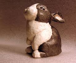 A brown rabbit mask made using traditional paper mache techniques, painted with acrylic paints and finished with acrylic gloss. Paper Mache Rabbit Using A Super Sculpey Form