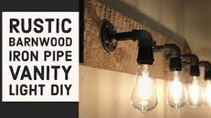 Give your bathroom a quick update with vanity lighting and elegant light fixtures. Make A Rustic Wood Iron Pipe Vanity Light Diy Youtube
