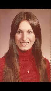 Graduation pics in 1976 with a v-neck velour gown