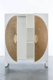 When the wax paper is removed, some gold leaf may extend past the edge of the halo area. Halo Wardrobe Modern Lacquer Body With Gold Leaf Inlay And Gold Leaf Handles For Sale At 1stdibs