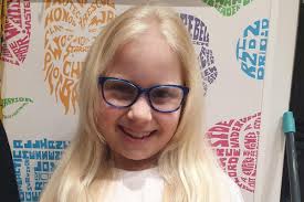 Crawley school girl raises money for charity by cutting 13 inches of hair  to help create wigs for children with cancer