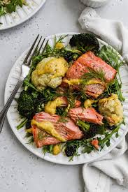This tasty salad combines egg, salmon, crunchy veggies, mayonnaise, and a handful of spices to make a light and nourishing lunch or dinner. Broccoli Cauliflower Salmon Salad With Curry Tahini Walder Wellness
