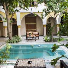 A 1940's bungalow was renovated and transformed for a small family. Courtyard Or Atrium As Part Of A House