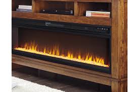 Wood is arranged in the bottom of a fireplace and ignited with a match or lighter. Entertainment Accessories Electric Fireplace Insert Ashley Furniture Homestore