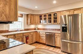 Kitchen glass backsplash with hickory cabinets. What Flooring Goes With Hickory Cabinets Designing Idea