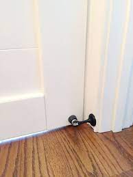 To keep the barn door from swinging, you can use bottom guides, door stoppers, magnets, or change the hardware. Stopping The Door Bower Power
