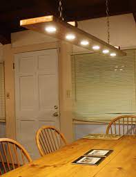 Rustic Dining Room Light For Under 100 Combine A Nice Piece Of Reclaimed Wood Some Low V Rustic Dining Room Lighting Rustic Dining Room Dining Room Lighting