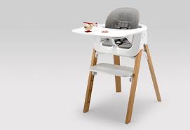 There's a receptacle hooked up to the arms of a high chair that permits adults to put food on that so the kid will choose it up and eat it or the. An Ergonomic Baby Chair That Grows With Your Kid