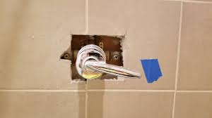 The faucet should slide very nicely through the hole you created in the tile. What Do You Do If The Hole In The Tile Is Larger Than The Shower Faucet Escutcheon Home Improvement Stack Exchange