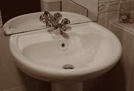 cleaning a sink overflow cascade maids