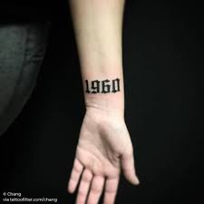 A roman numeral tattoo might also have dots, periods or dashes separating the month, day and year. 20 Symbolic Wrist Birth Year Tattoo