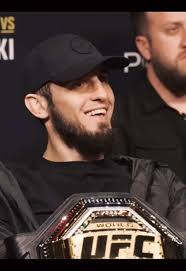 HASBULLA gives Islam Makhachev his UFC belt during Islam's faceoff wit...