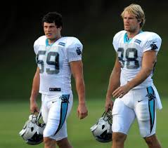 Carolina Panthers Linebacker Luke Kuechly Left And Tight End Greg Olsen Right Walk To The Pra Carolina Panthers Football Carolina Panthers Panthers Football