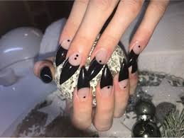 T A I N T E D C A N V A S N U G O T H C L A W S Acrylic nails with coffin shape.