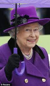 Purple Rain Queen Elizabeth Brightens Up A Damp Day In A Stylish Violet Coat And Trendy Fedora Hat On A Visit To The Jubilee Gardens Elizabeth Ii Queen Elizabeth Queen Hat
