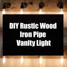 The last project of my bathroom remodel was to cover the outdated vanity lighting fixture, i'll show you how i did it plus you get a tour of the finished bat. Diy Rustic Wood Iron Pipe Vanity Light