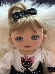 I am a seamstress ( self taught) also a reborn and silicone artist..This  baby was painted by me and her outfit was designed and made by myself as  well.