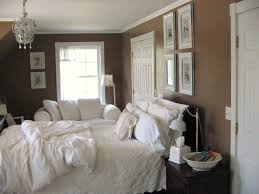 The room features brown walls and a custom wooden ceiling. White And Mocha Room Brown Bedroom Walls Brown Walls Brown Bedroom