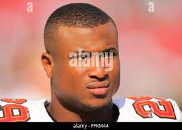 Tampa Bay Buccaneers cornerback Leonard Johnson (29) leaps into the end  zone, as he returns an interception 83 yards for a touchdown during the  fourth quarter at Raymond James Stadium in Tampa,