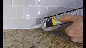 Learn how to seal grout in a shower, on the floor, or on a backsplash. How To Install Caulk On A Kitchen Tile Backsplash Youtube