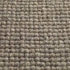 The combination of large islands of cut tufts and lower loop tufts hides wear well. Loop Pile Carpet Chandigarh Jacaranda Hand Woven Wool Tertiary