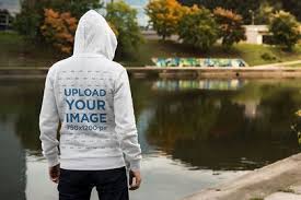 Download Placeit Back View Mockup Of A Man Wearing A Hoodie By A Lake Hoodie Mockup Clothing Mockup Mockup Generator