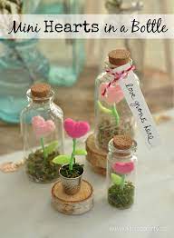 Mini Hearts In A Bottle Tiny Felt Heart Flowers Inside A Glass Jar Create A Magical Terrarium Garden Crafts With Glass Jars Bottle Crafts Mini Glass Bottles