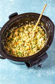 Place potatoes, onions, celery, carrots, chicken, herbs, and spices into a greased crock pot. Creamiest Crockpot Chicken And Rice The Girl On Bloor