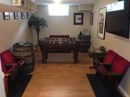 Old Whiskey Barrels As Side Tables Complete A Small Man Cave Small Man Cave Interior Design Living Room Mancave Interior Design