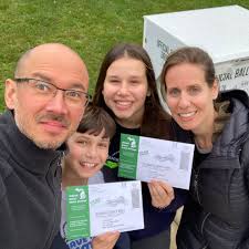 FordSchoolVotes: Professor Dean Yang and BA Program Director Sharon Maccini  drop off their ballots as a family by the North Campus Fire Station. Staff  member Kyle Kwaiser also drops off his ballot!