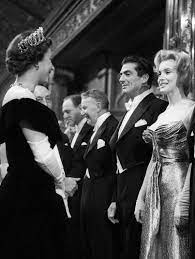 October 29 1956 Marilyn Is Introduced To Elizabeth Ii At The Empire Theatre At Leicester Square Lo Marilyn Monroe Costume Queen Elizabeth Classic Hollywood