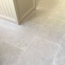 White marble tiles add to the light and airy feel in this compact kitchen. Limestone Is Proving More And More Popular For A Stone Kitchen Floor