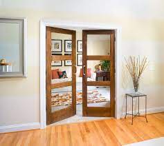 There is no glass ~ industrial ruins cover window panes with colorful sticky paper. Interior Doors Tague Lumber