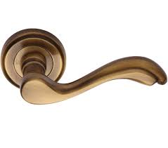 heritage brass lisboa antique brass door handles on round rose v1601 at sold in pairs from door in 2020 brass door handles antique brass door handles door handles
