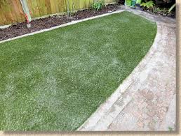 Generally you do not lay paving slabs directly on grass if you want them to last and look good for any length of time. Installing An Artificial Grass Lawn Pavingexpert