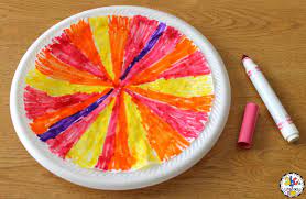 These tie dye coffee filter butterflies are quick and easy for kids to create and a great exercise in color theory and blending! Tie Dye Coffee Filter Flower Craft For Kids Process Art Activity